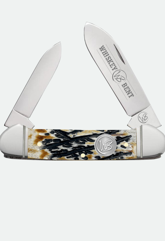 WHISKEY BENT CARVED BURNT BONE CANOE